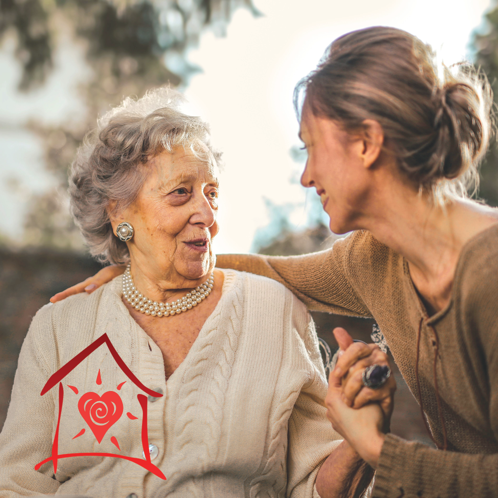 Woman holding hands with happy senior woman